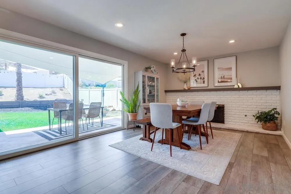 10262 Molino Road Santee, CA 92071 - Photo 8 of 26 a view of a dining room with furniture window and wooden floor