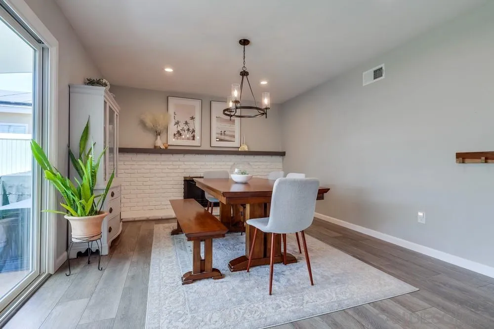 10262 Molino Road Santee, CA 92071 - Photo 9 of 26 a view of a dining room with furniture window and wooden floor