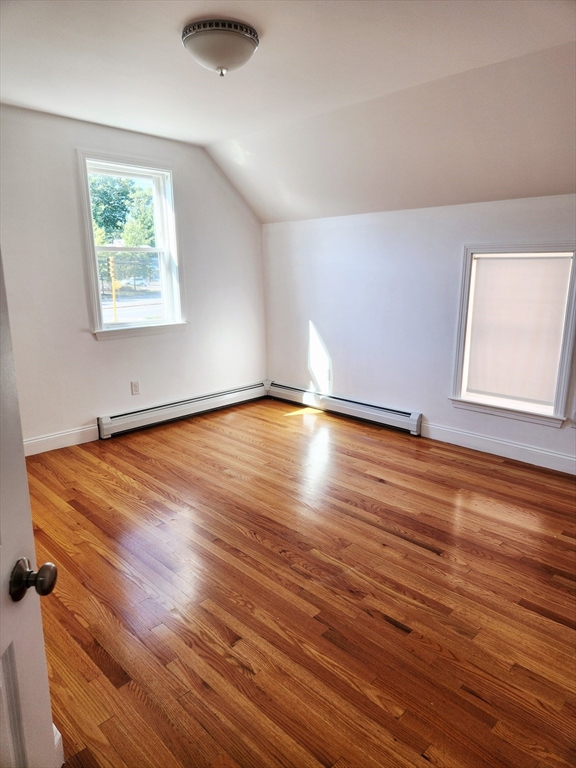 321 East Street Dedham, MA 02026 - Photo 11 of 18 an empty room with wooden floor and windows