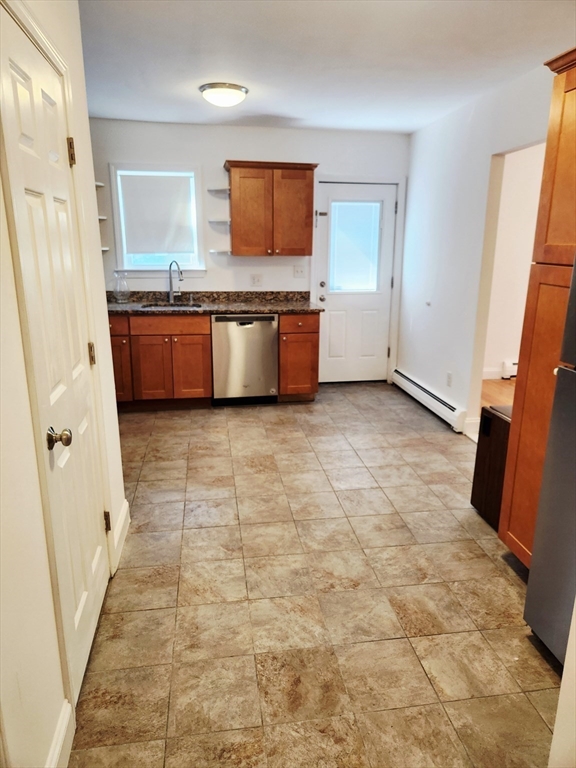 321 East Street Dedham, MA 02026 - Photo 7 of 18 a view of a kitchen with electric appliances