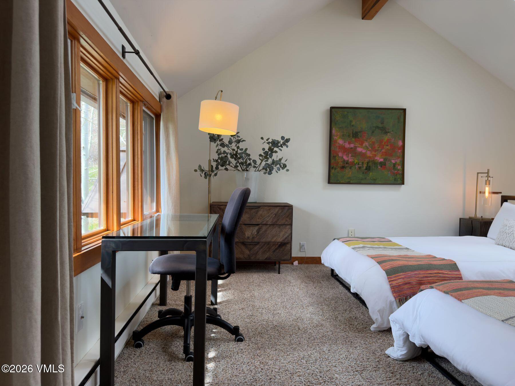 2875 Manns Ranch Road, Unit J2 Vail, CO 81657 - Photo 16 of 25 a bedroom with a bed and a window