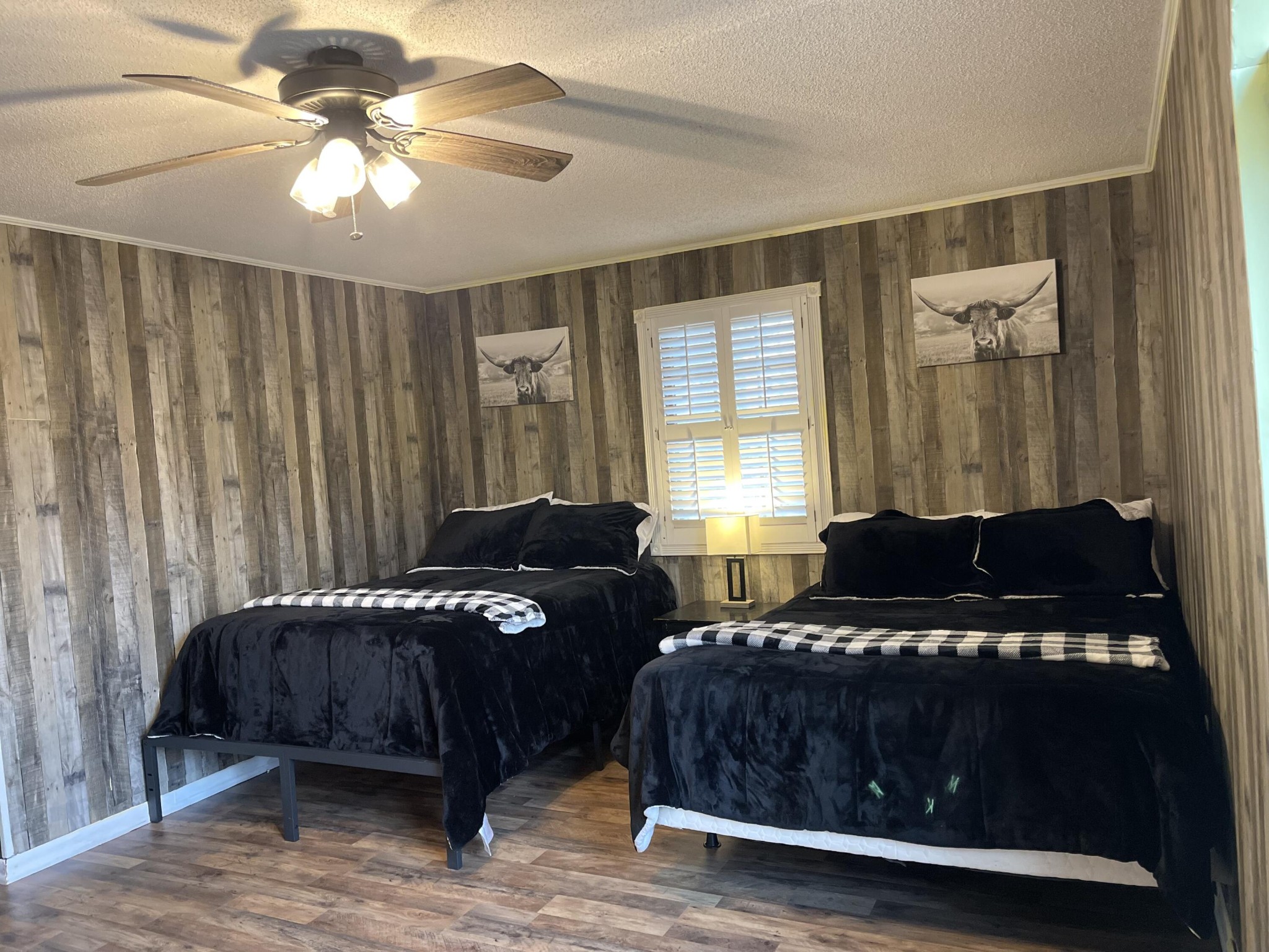 1522 Turkey Creek Road Tellico Plains, TN 37385 - Photo 21 of 34 a bedroom with a bed and a chandelier