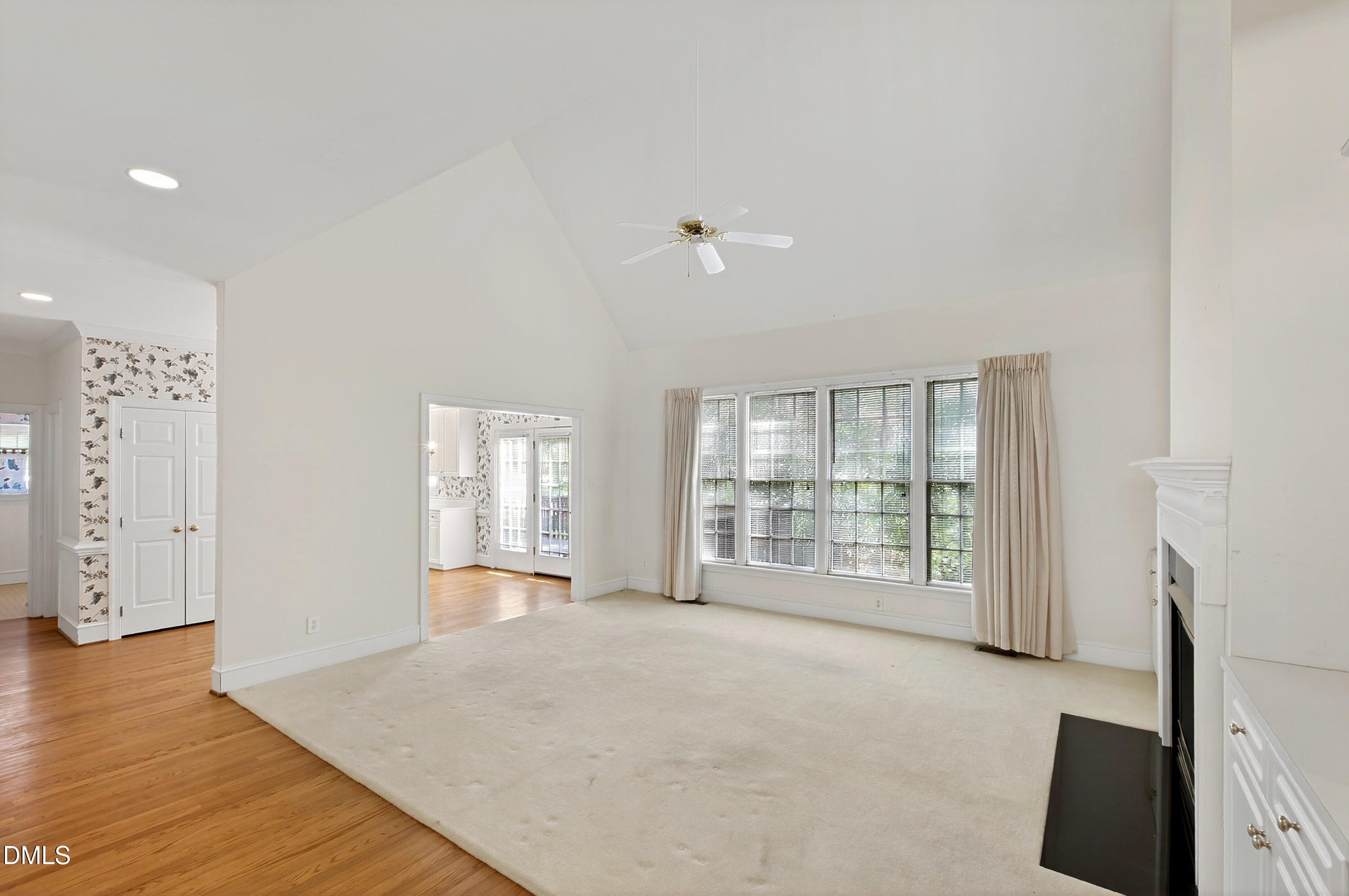 913 Tanworth Drive Raleigh, NC 27615 - Photo 12 of 48 wooden floor in an empty room with a window