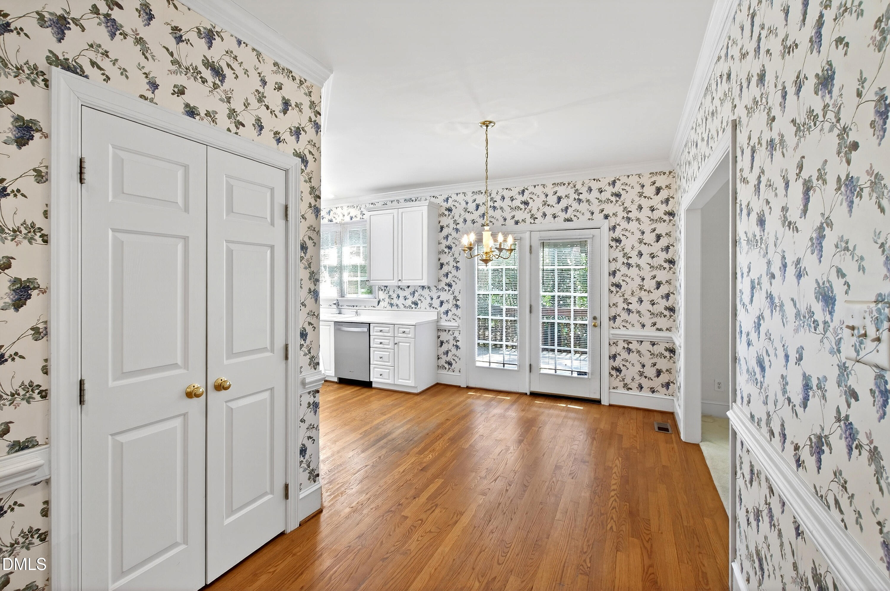 913 Tanworth Drive Raleigh, NC 27615 - Photo 14 of 48 a view of a kitchen with wooden floor and electronic appliances