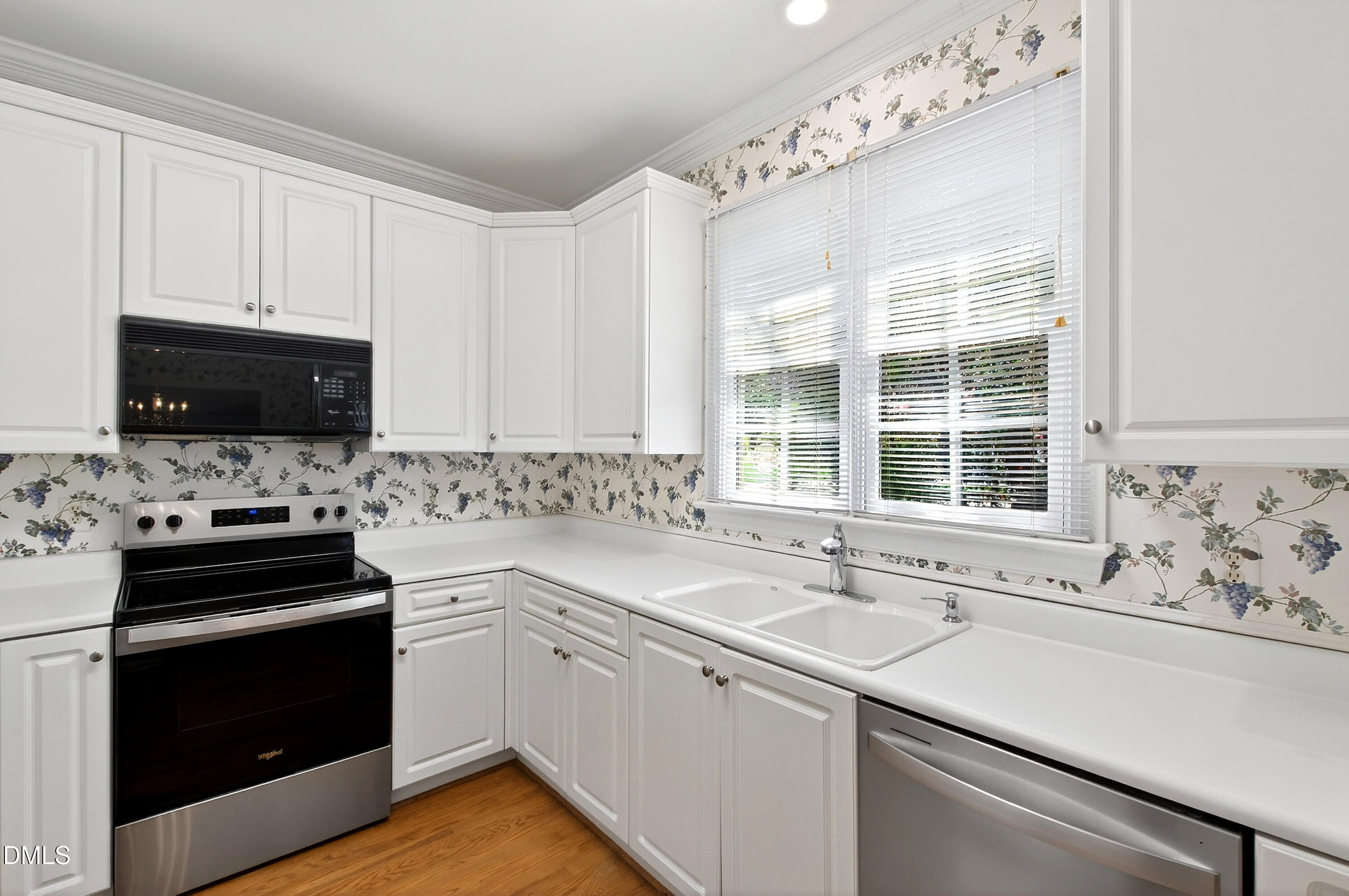 913 Tanworth Drive Raleigh, NC 27615 - Photo 17 of 48 a kitchen with a sink stove oven and window