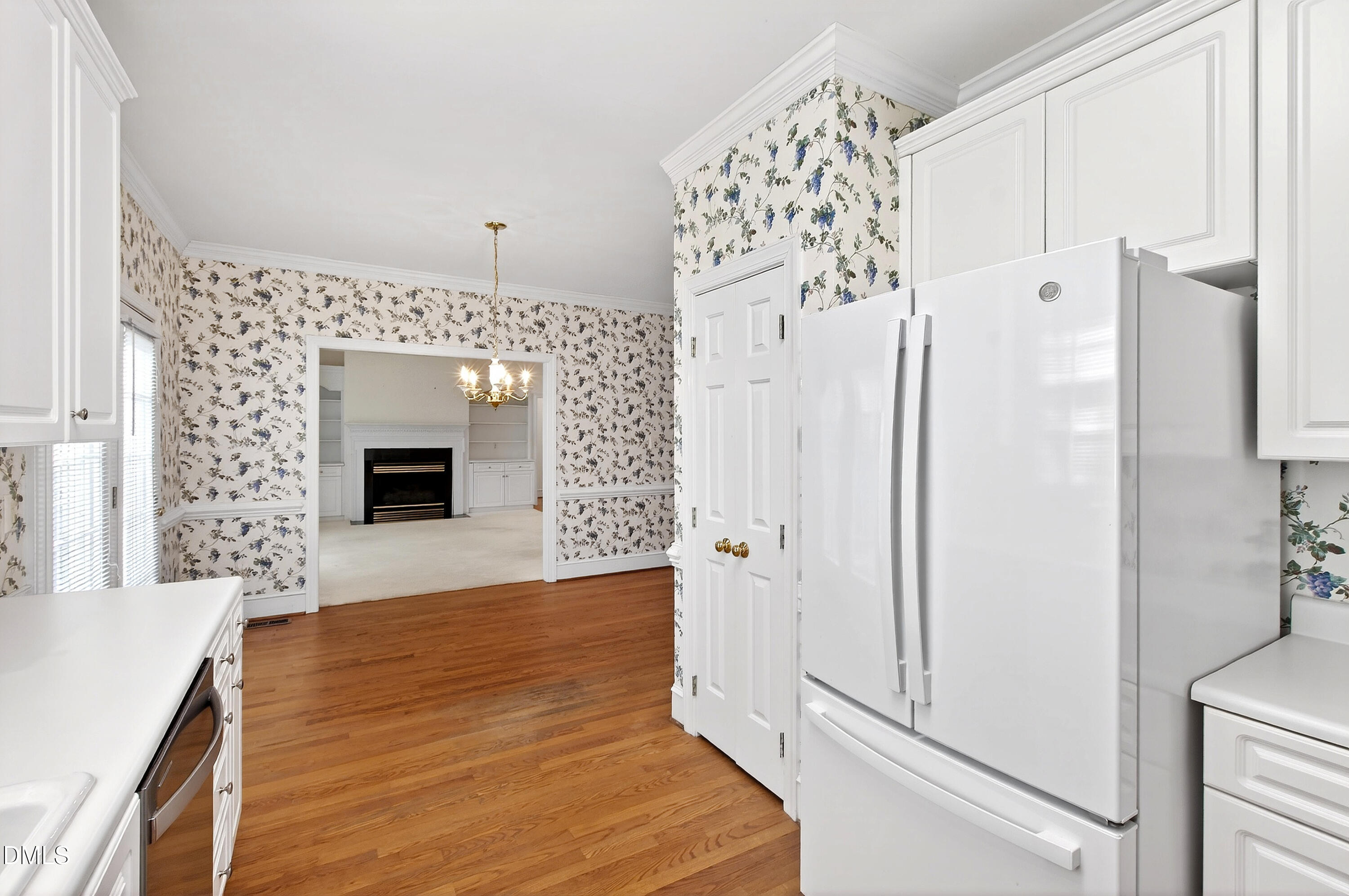 913 Tanworth Drive Raleigh, NC 27615 - Photo 20 of 48 a view of a hallway with wooden floor and staircase