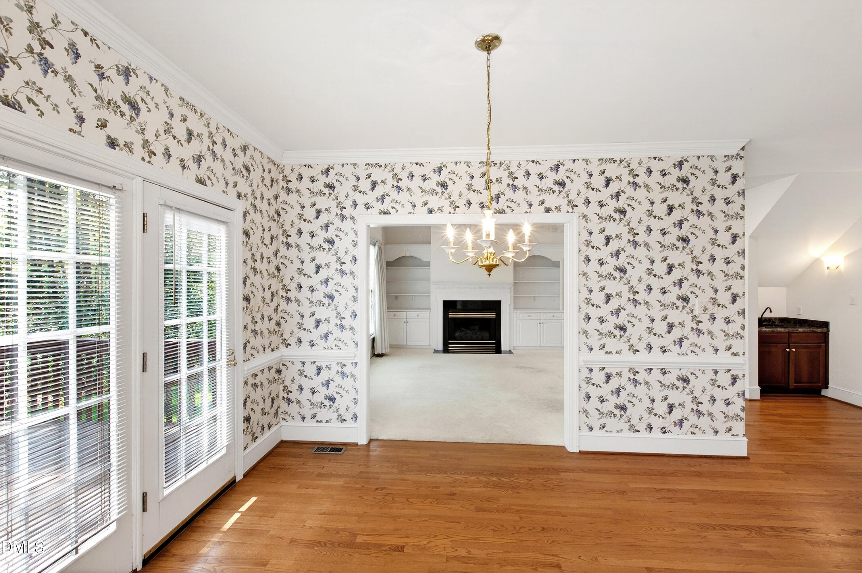 913 Tanworth Drive Raleigh, NC 27615 - Photo 21 of 48 a view of a floor to ceiling window and wooden floor