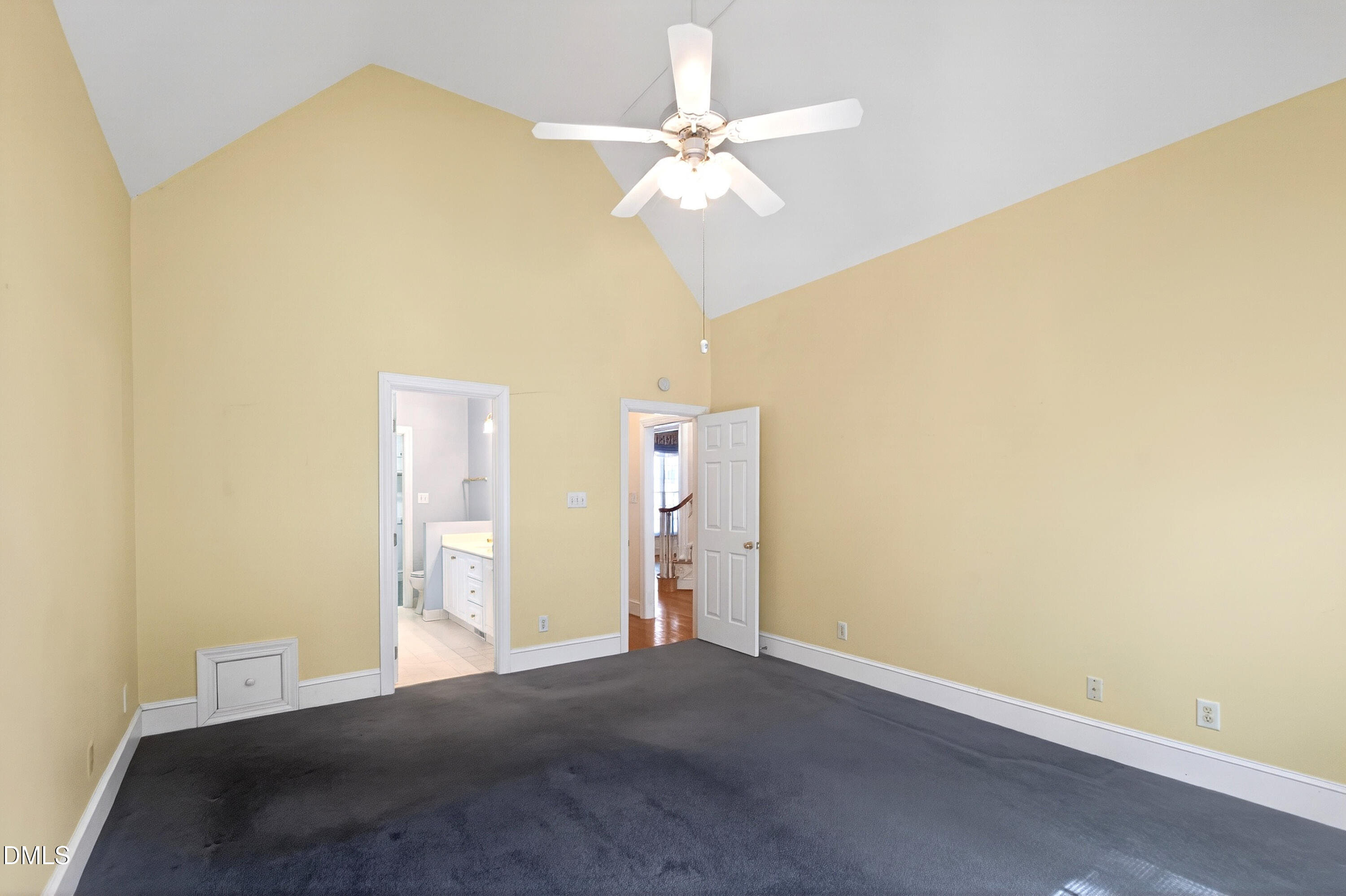 913 Tanworth Drive Raleigh, NC 27615 - Photo 23 of 48 a bedroom with a bed and a chandelier