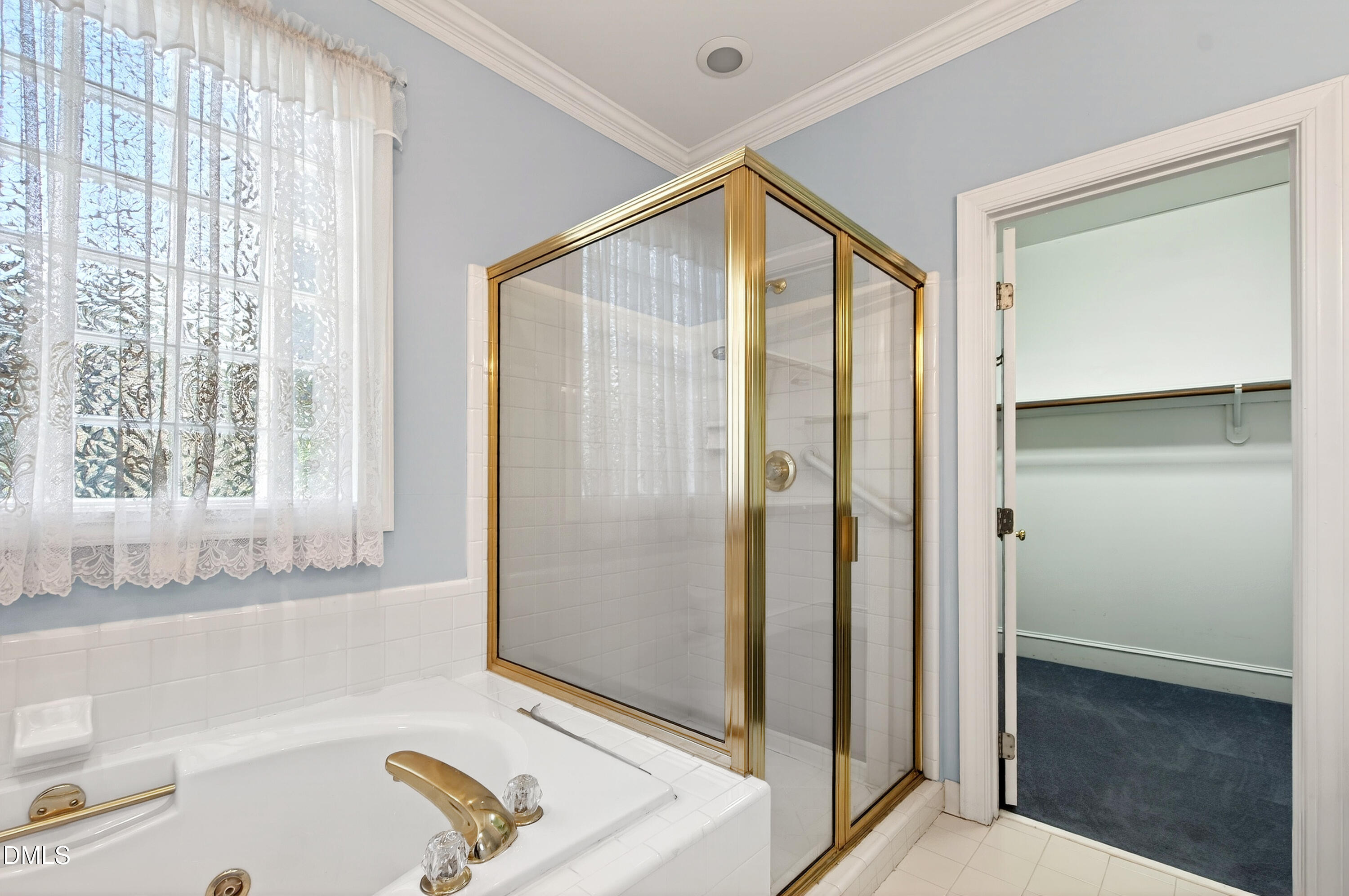 913 Tanworth Drive Raleigh, NC 27615 - Photo 25 of 48 a bathroom with a tub and a shower