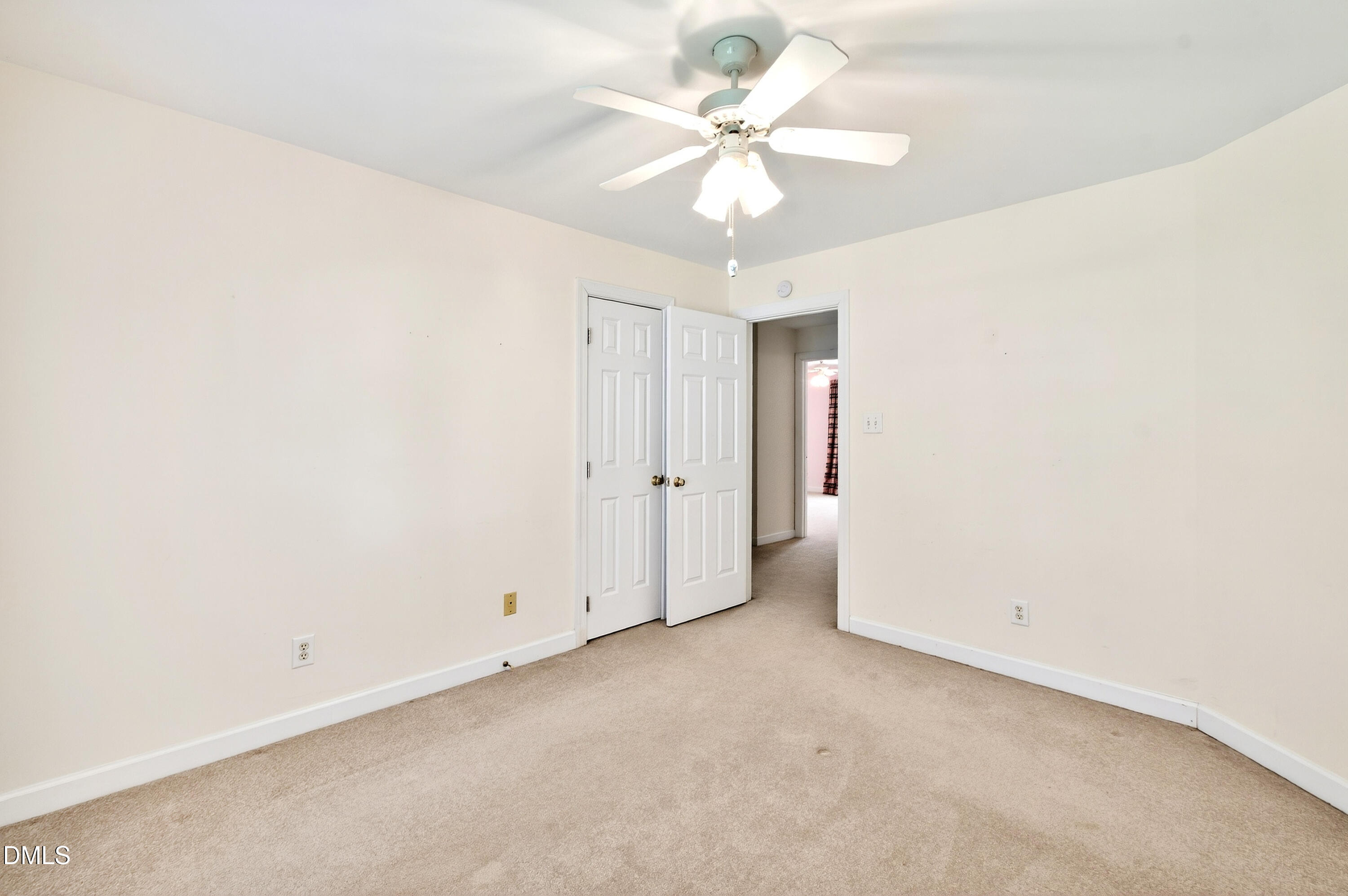 913 Tanworth Drive Raleigh, NC 27615 - Photo 30 of 48 an empty room with a ceiling fan and a window