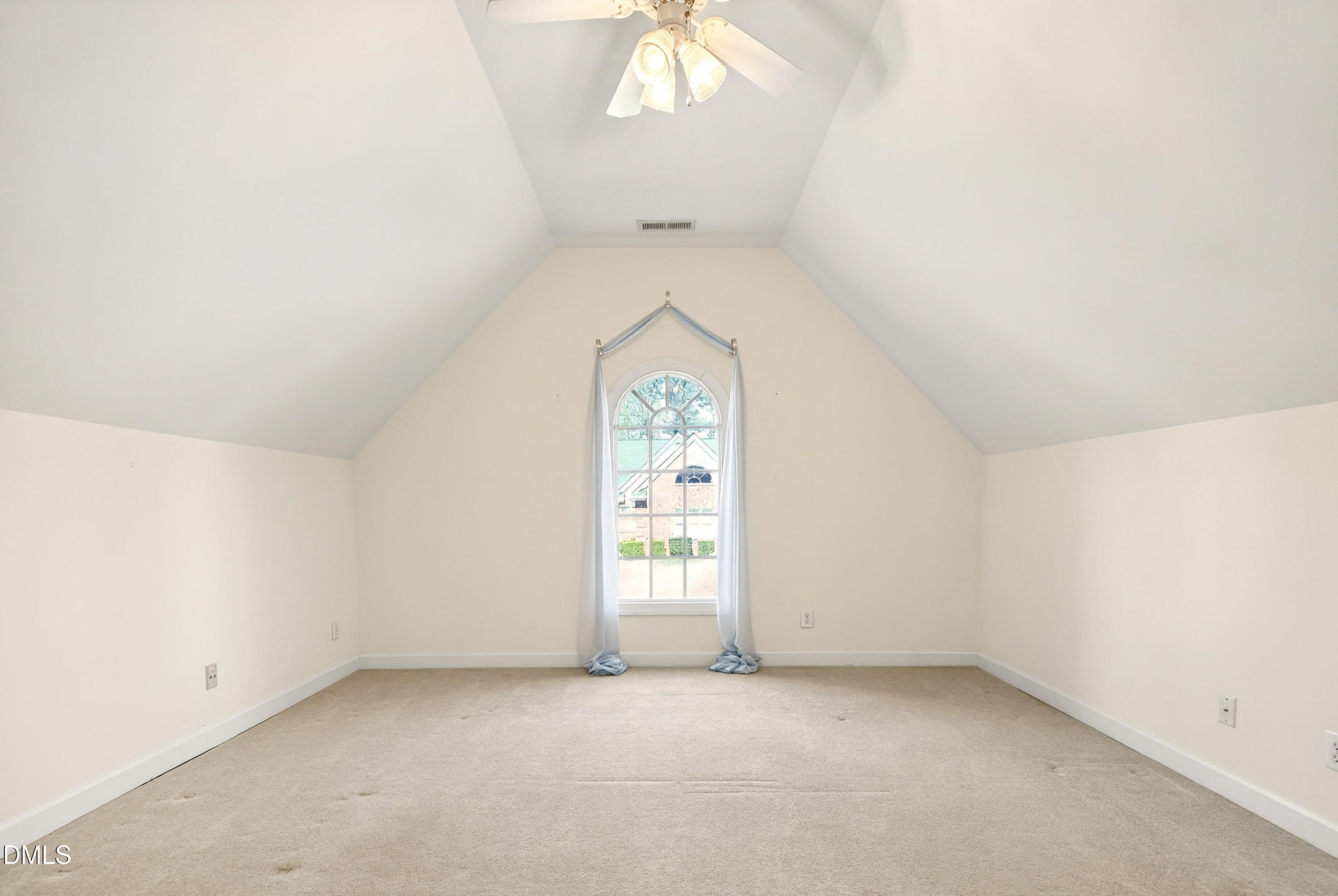 913 Tanworth Drive Raleigh, NC 27615 - Photo 33 of 48 an empty room with a window and a ceiling fan