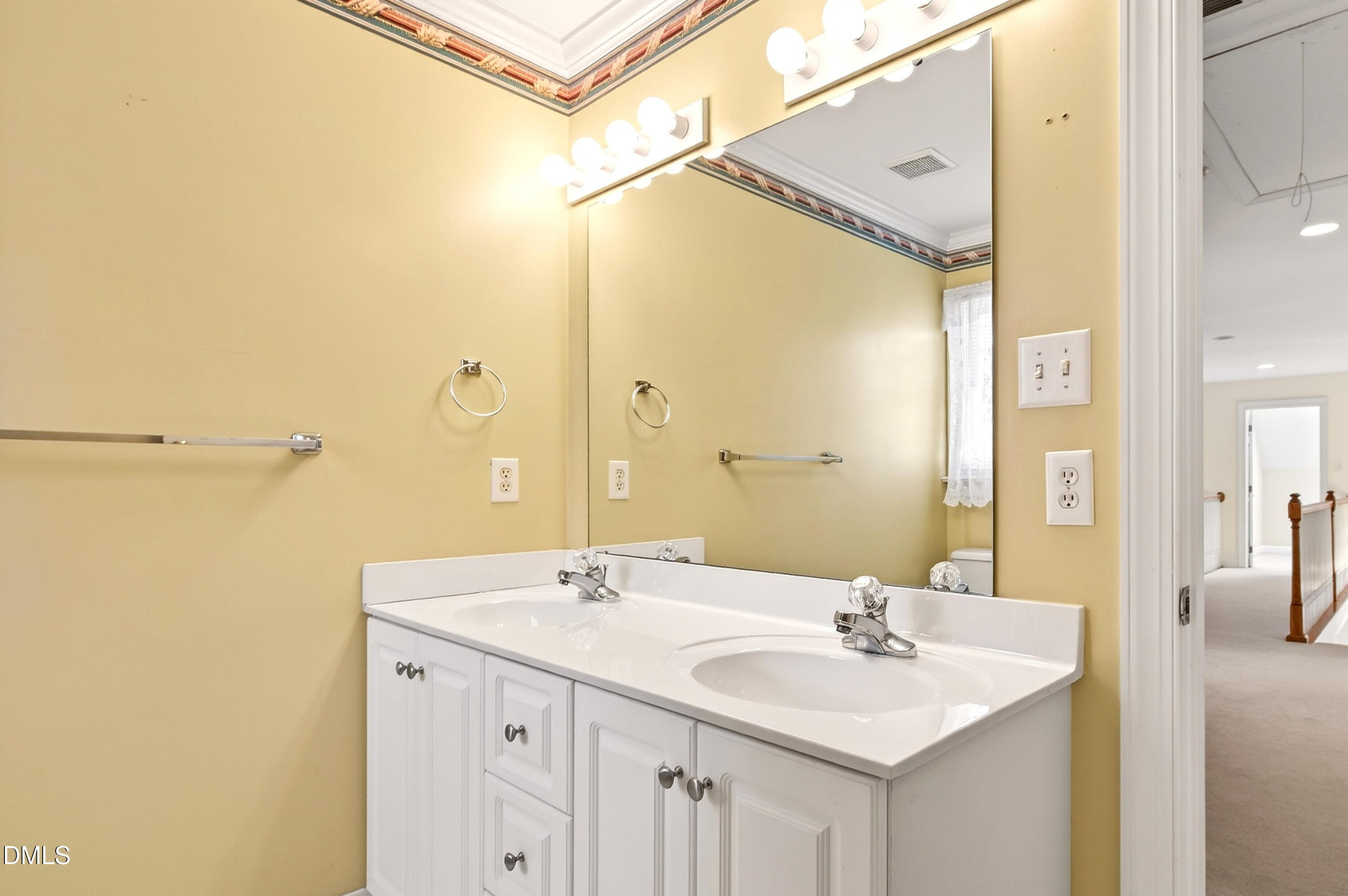 913 Tanworth Drive Raleigh, NC 27615 - Photo 35 of 48 a bathroom with a sink and a mirror