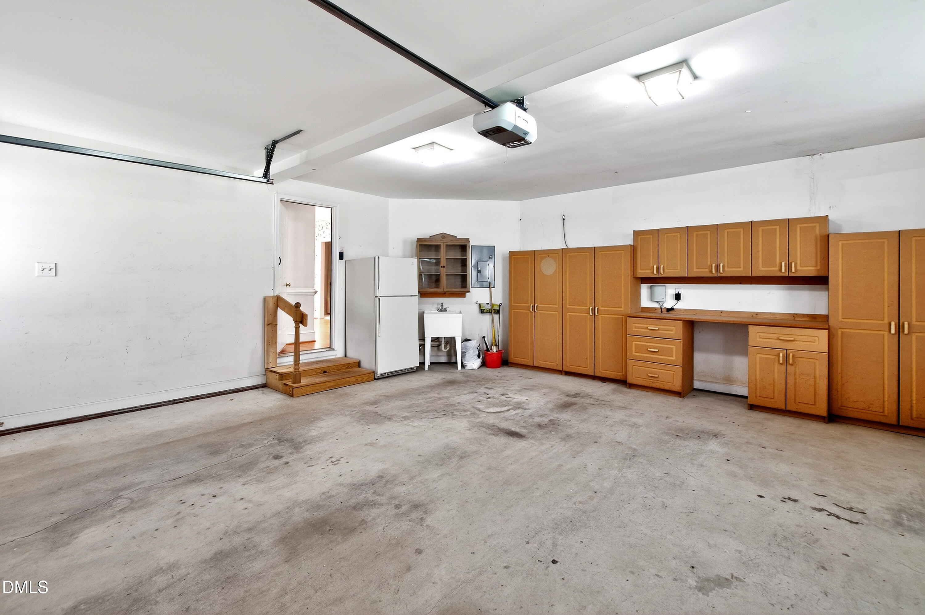 913 Tanworth Drive Raleigh, NC 27615 - Photo 40 of 48 a view of a kitchen with a sink and a refrigerator