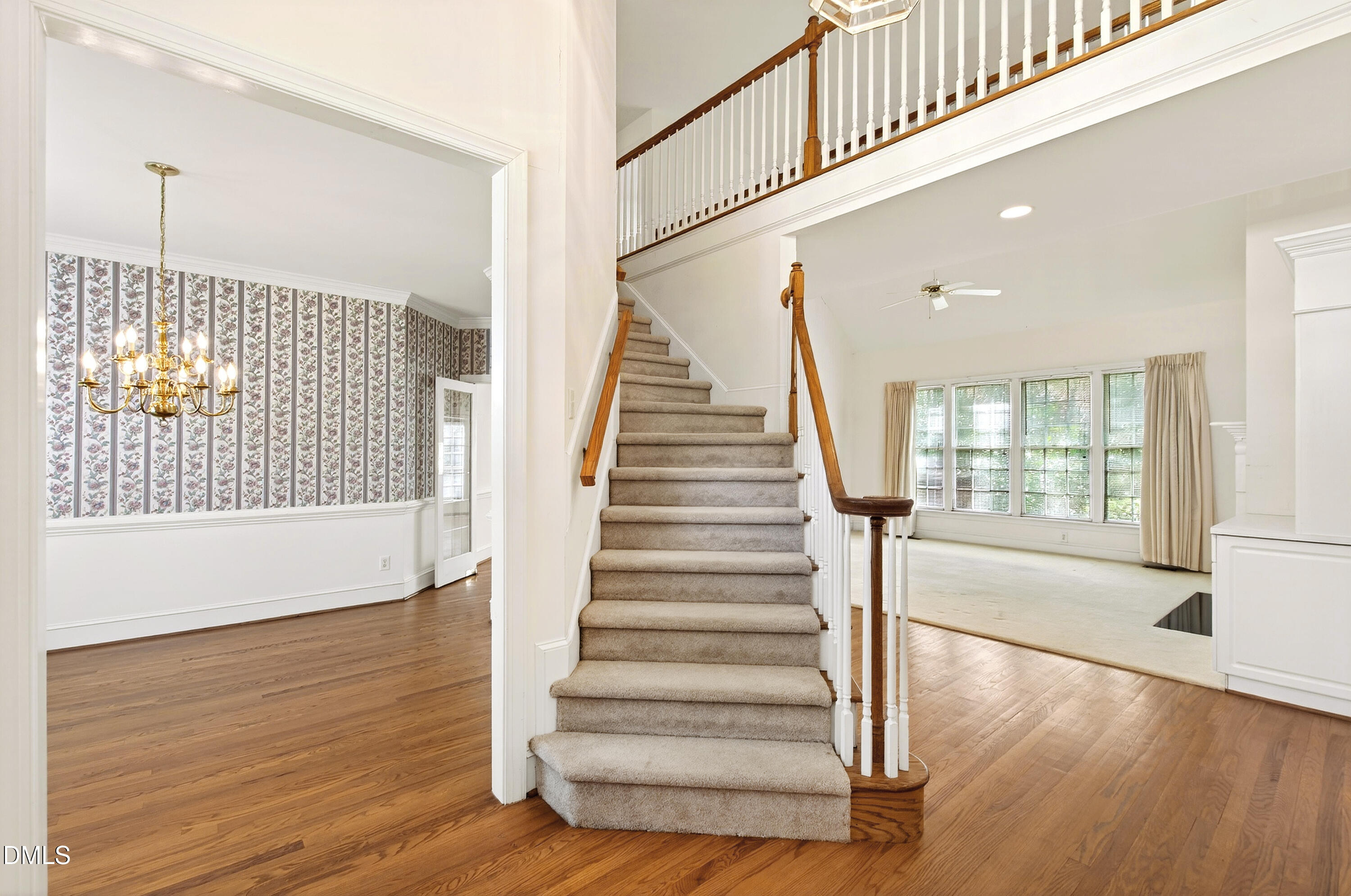 913 Tanworth Drive Raleigh, NC 27615 - Photo 4 of 48 a view of staircase with white walls and windows