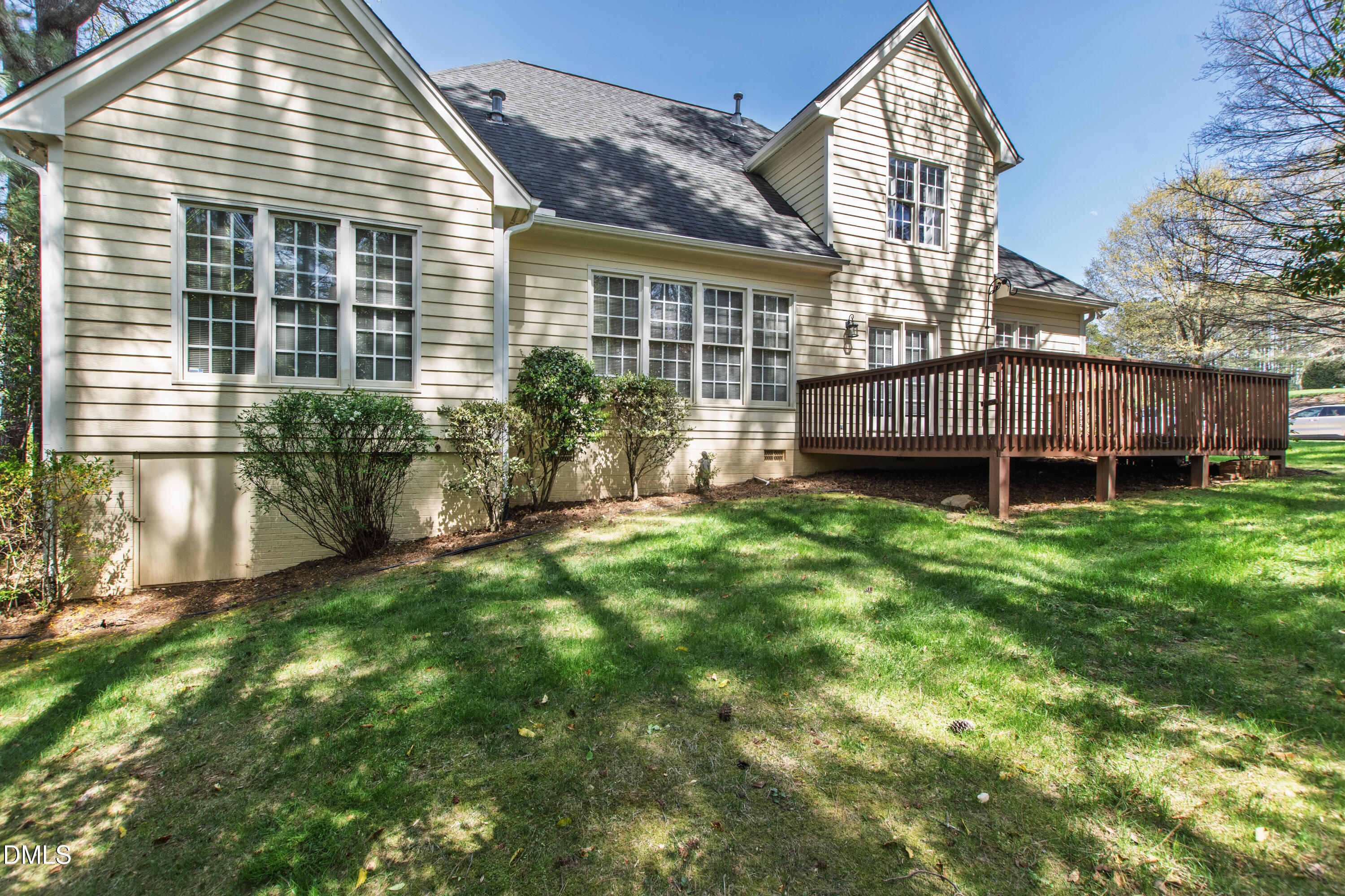 913 Tanworth Drive Raleigh, NC 27615 - Photo 45 of 48 a view of a house with a backyard and deck