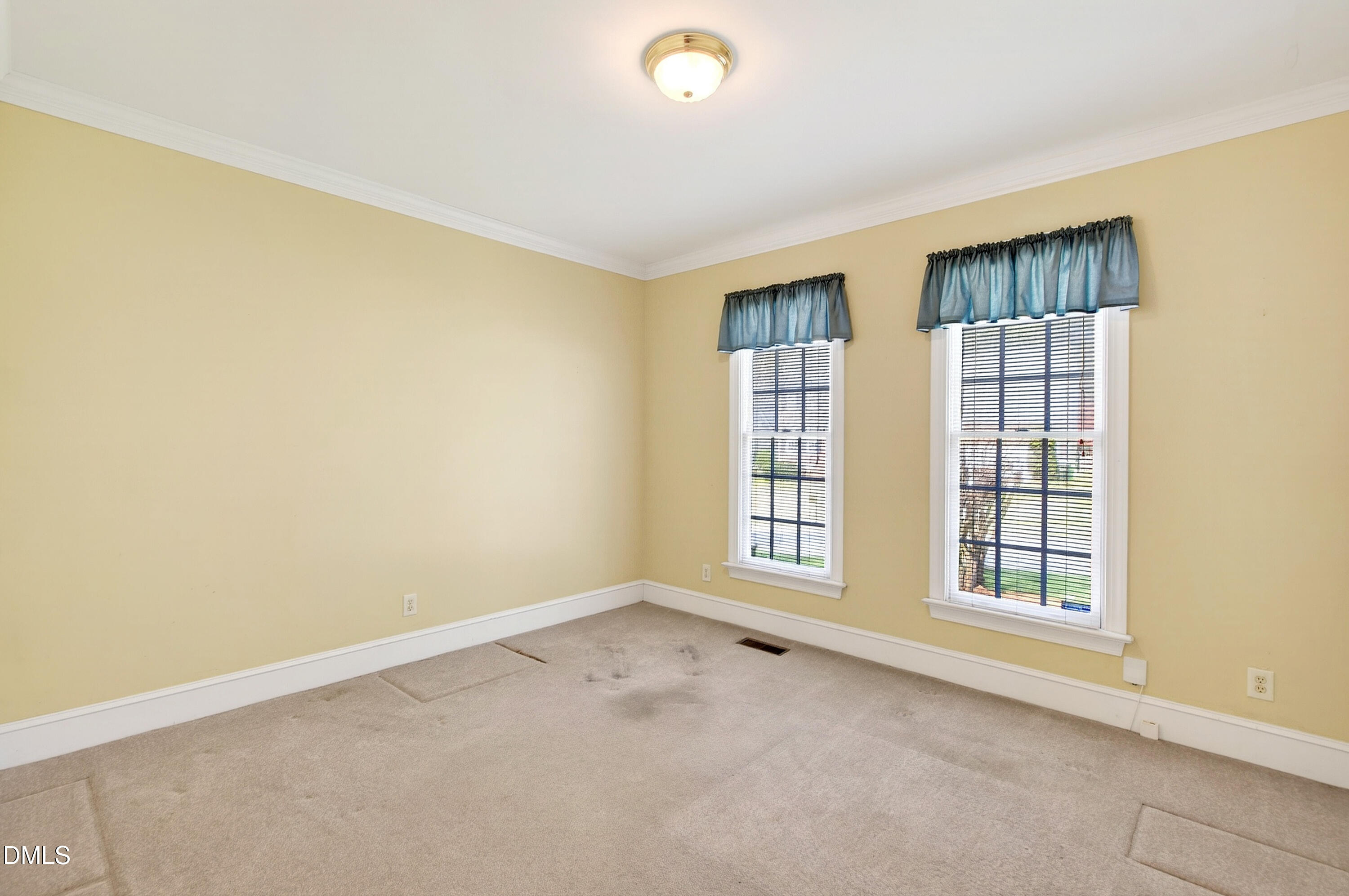 913 Tanworth Drive Raleigh, NC 27615 - Photo 5 of 48 a view of an empty room with a window
