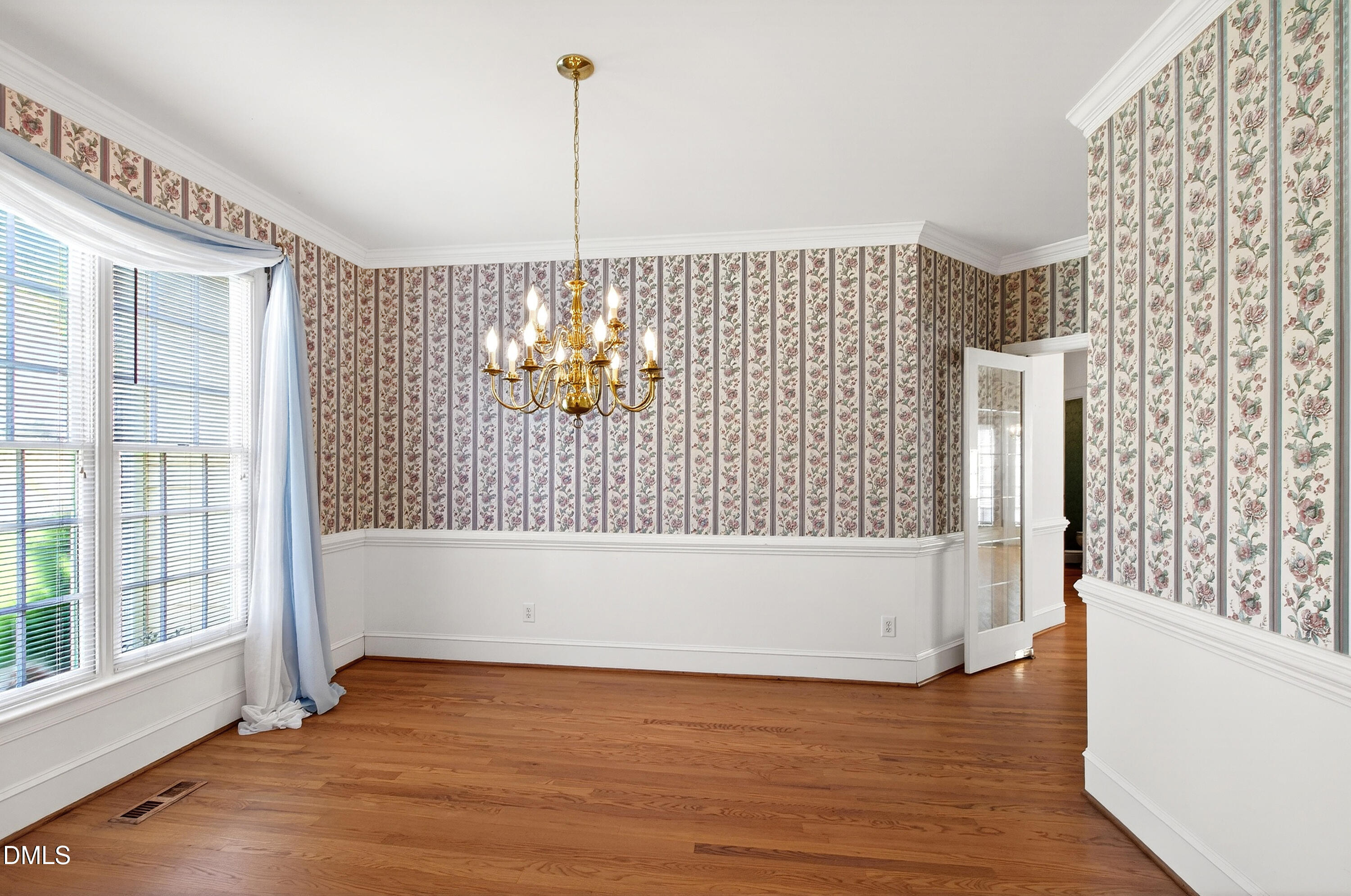913 Tanworth Drive Raleigh, NC 27615 - Photo 7 of 48 a view of empty room with wooden floor and fan