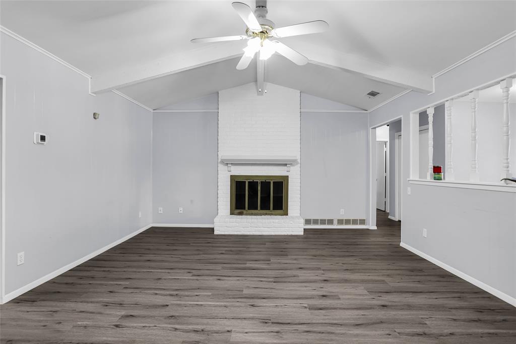 1327 Big Stone Gap Road Duncanville, TX 75137 - Photo 12 of 36 a view of an empty room with window and wooden floor