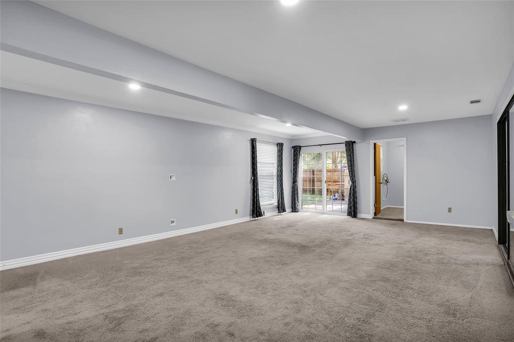 1327 Big Stone Gap Road Duncanville, TX 75137 - Photo 15 of 36 a view of an empty room with wooden floor and closet