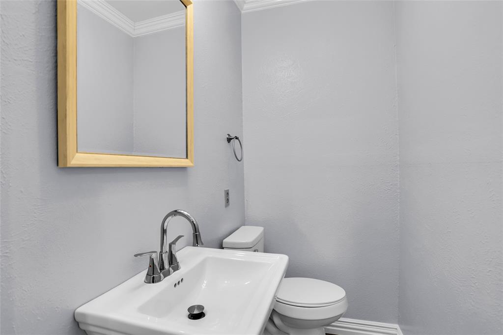 1327 Big Stone Gap Road Duncanville, TX 75137 - Photo 18 of 36 a bathroom with a sink and a toilet