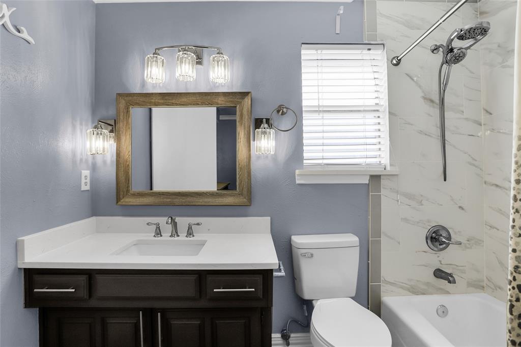 1327 Big Stone Gap Road Duncanville, TX 75137 - Photo 30 of 36 a bathroom with a sink a toilet and shower