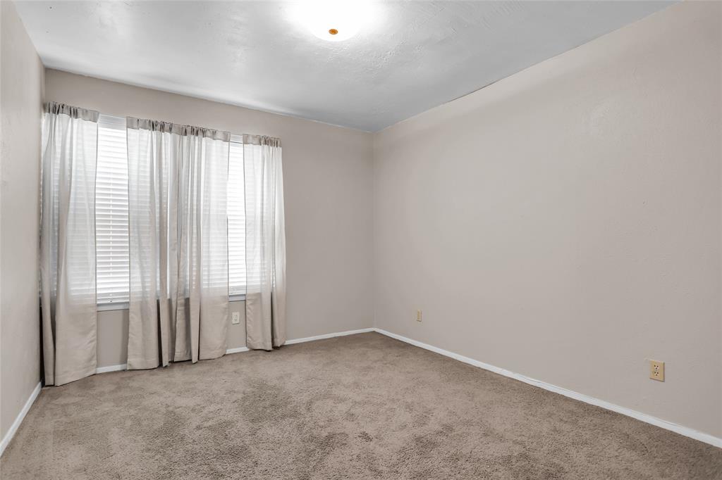 1327 Big Stone Gap Road Duncanville, TX 75137 - Photo 32 of 36 an empty room with windows