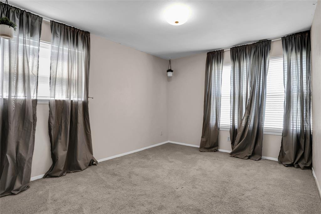 1327 Big Stone Gap Road Duncanville, TX 75137 - Photo 33 of 36 an empty room with windows