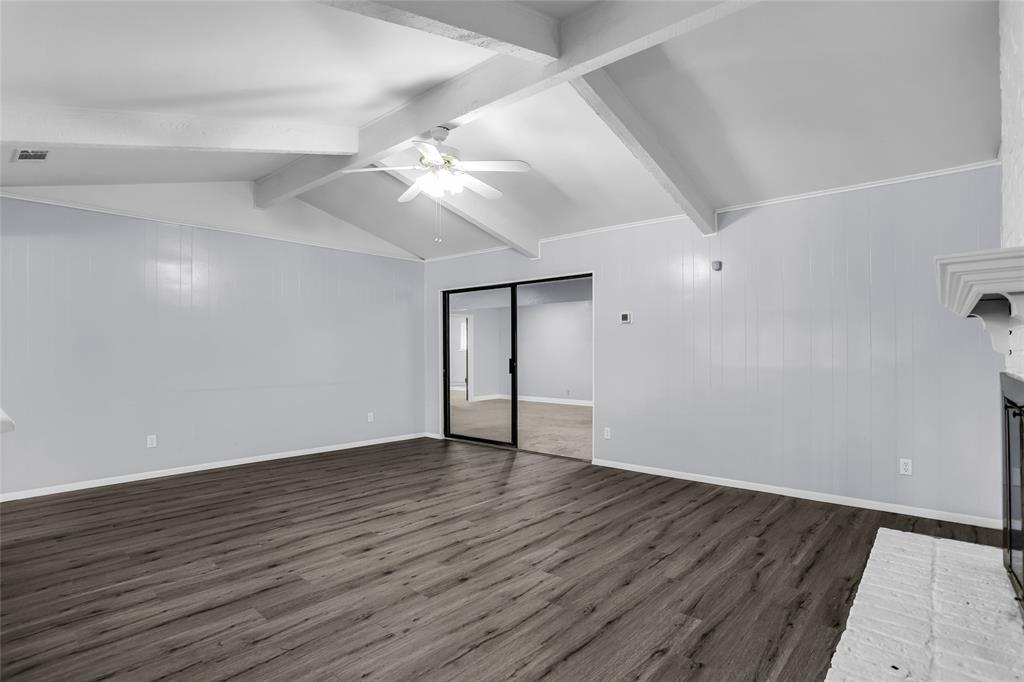 1327 Big Stone Gap Road Duncanville, TX 75137 - Photo 5 of 36 an empty room with wooden floor and ceiling fan