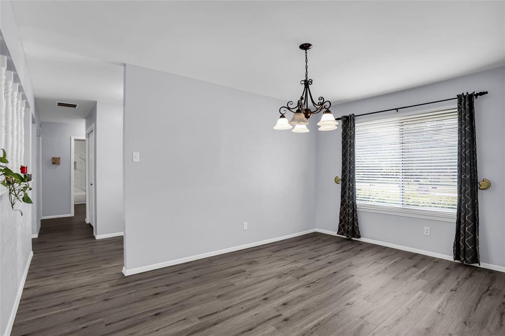 1327 Big Stone Gap Road Duncanville, TX 75137 - Photo 8 of 36 a view of a room with wooden floor chandelier and entryway