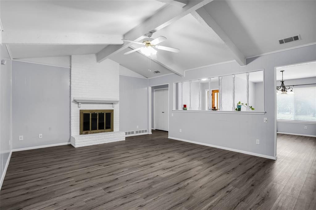 1327 Big Stone Gap Road Duncanville, TX 75137 - Photo 10 of 36 a view of a kitchen with an empty space and a fireplace