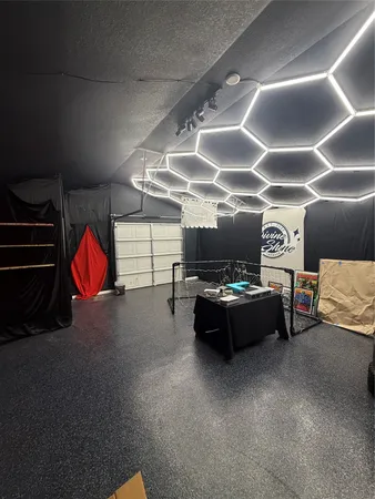 a room with furniture and gym equipment