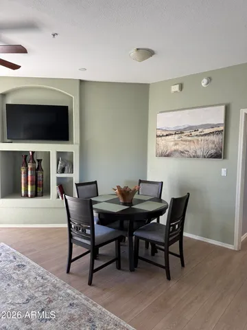 a view of an empty room with a fireplace and a window