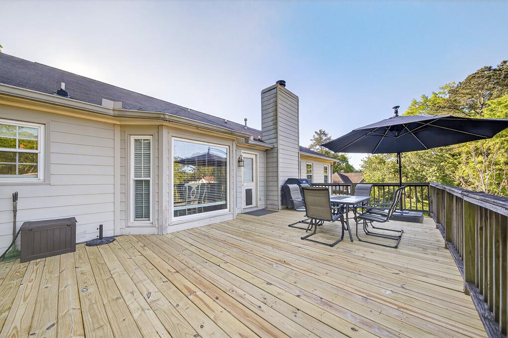 7333 Cedar Creek Loop Columbus, GA 31904 - Photo 36 of 37 a view of a deck with furniture and umbrella