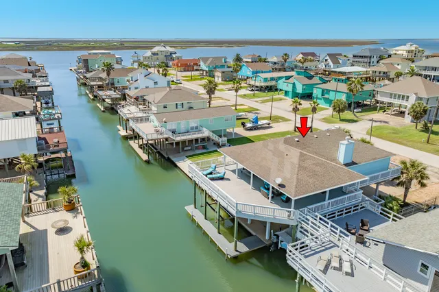 an aerial view of a house with outdoor space