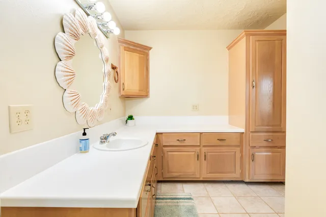 a bathroom with a sink a vanity and a bathtub