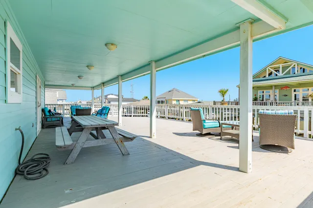 a balcony with furniture and a fireplace