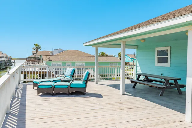 a swimming pool with outdoor seating and yard