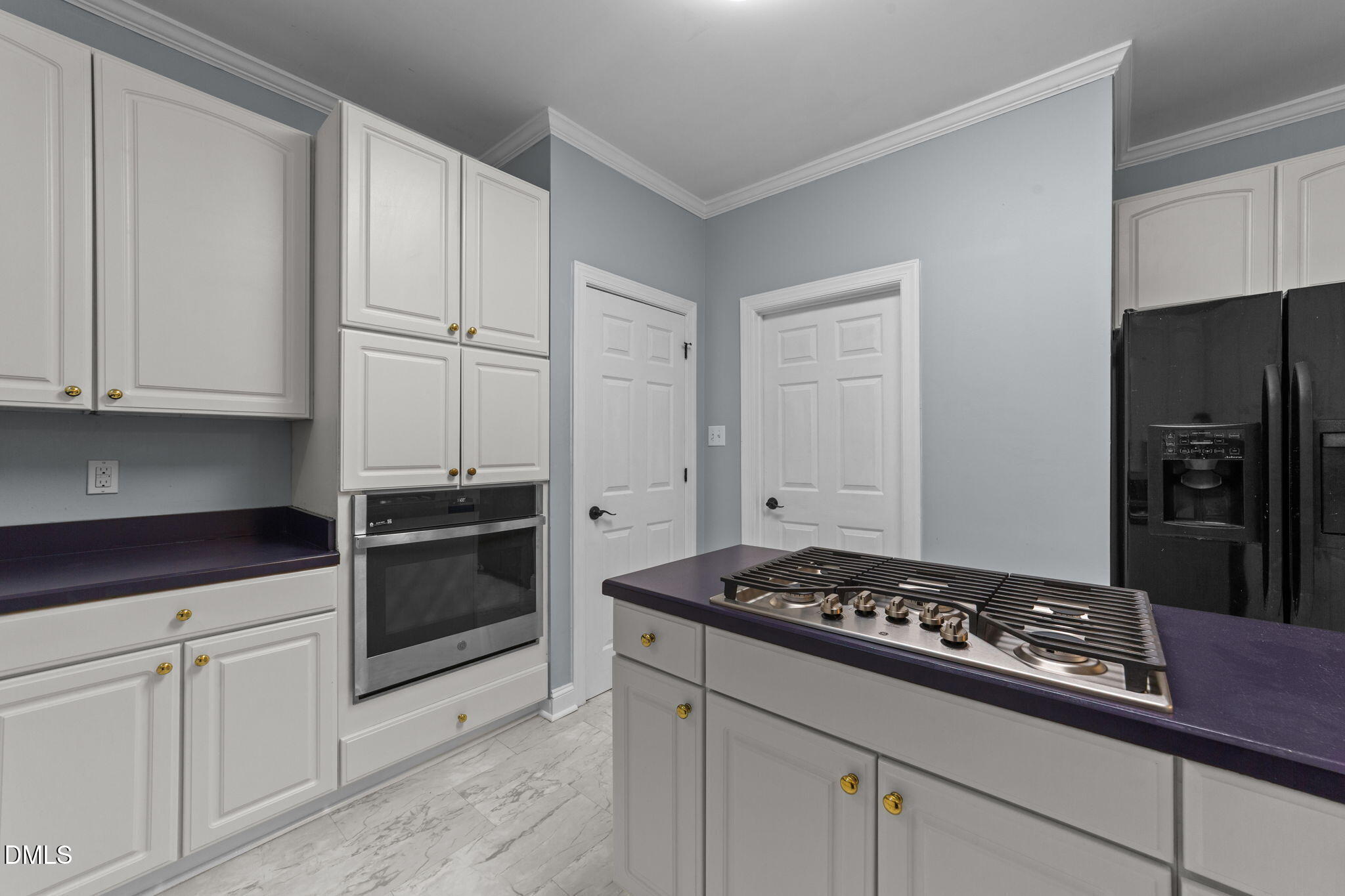 208 Adams Court Clayton, NC 27520 - Photo 11 of 63 a kitchen with granite countertop cabinets and steel stainless steel appliances