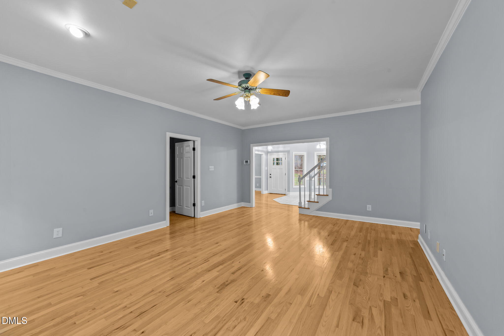 208 Adams Court Clayton, NC 27520 - Photo 21 of 63 a view of empty room with wooden floor and fan