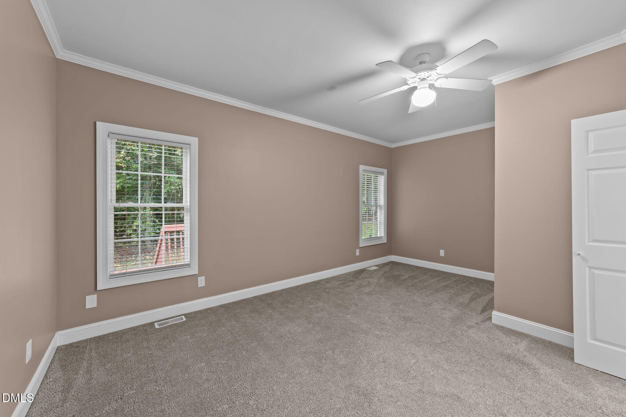 208 Adams Court Clayton, NC 27520 - Photo 22 of 63 an empty room with windows and fan