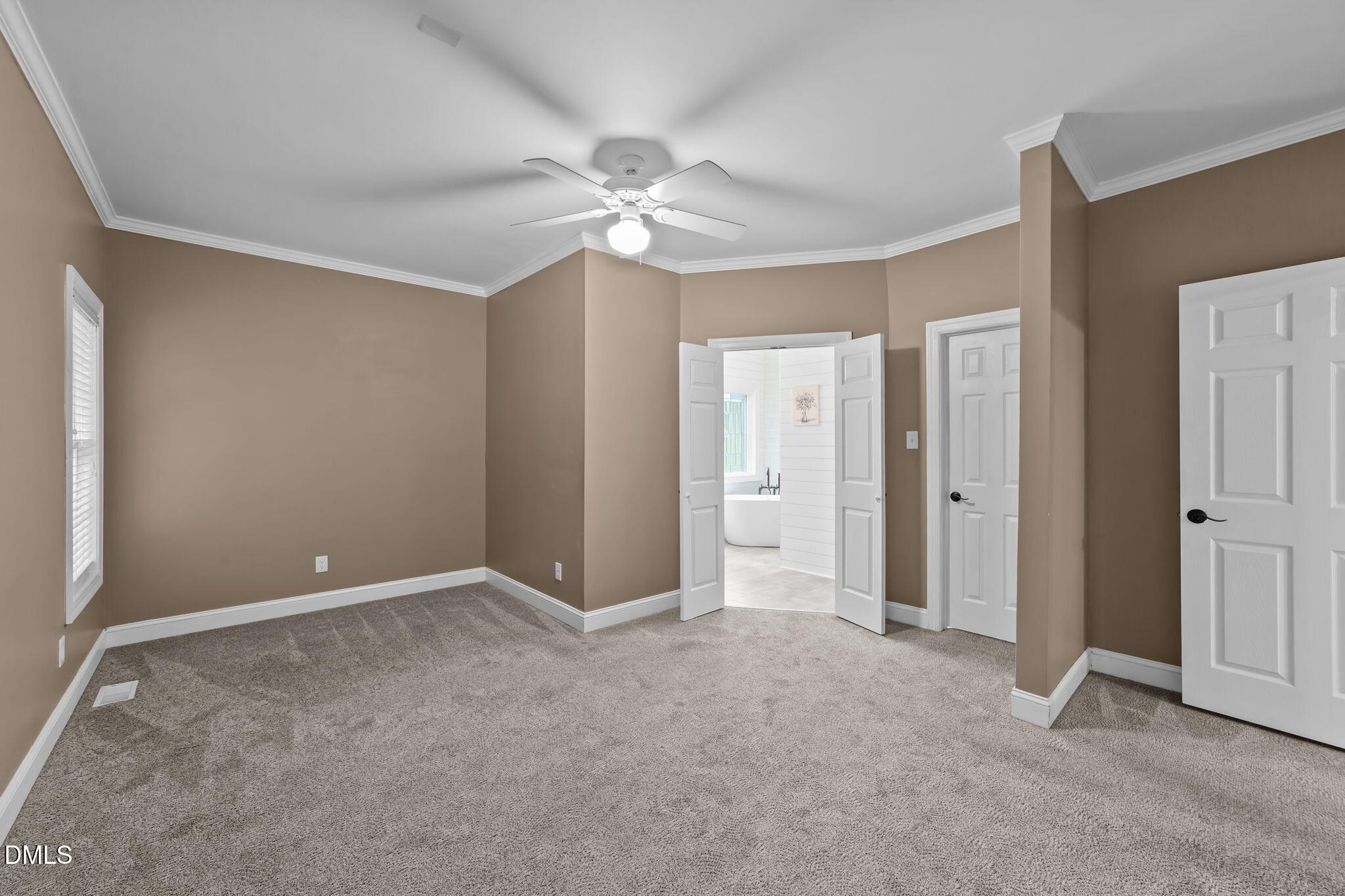 208 Adams Court Clayton, NC 27520 - Photo 23 of 63 a view of an empty room and chandelier fan