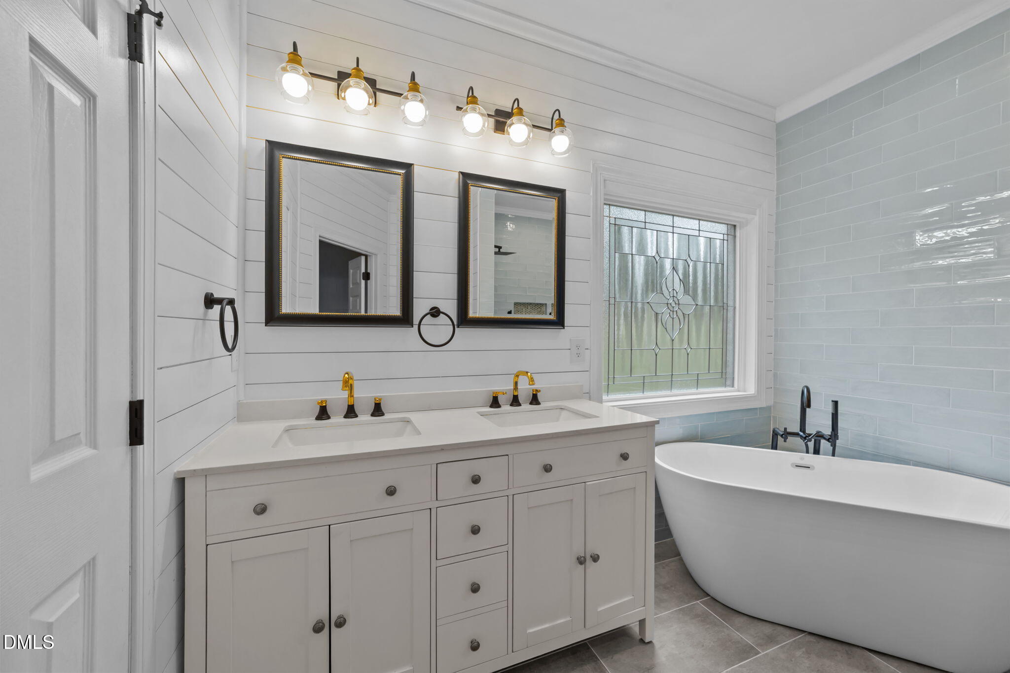208 Adams Court Clayton, NC 27520 - Photo 26 of 63 a bathroom with a double vanity sink mirror and bathtub