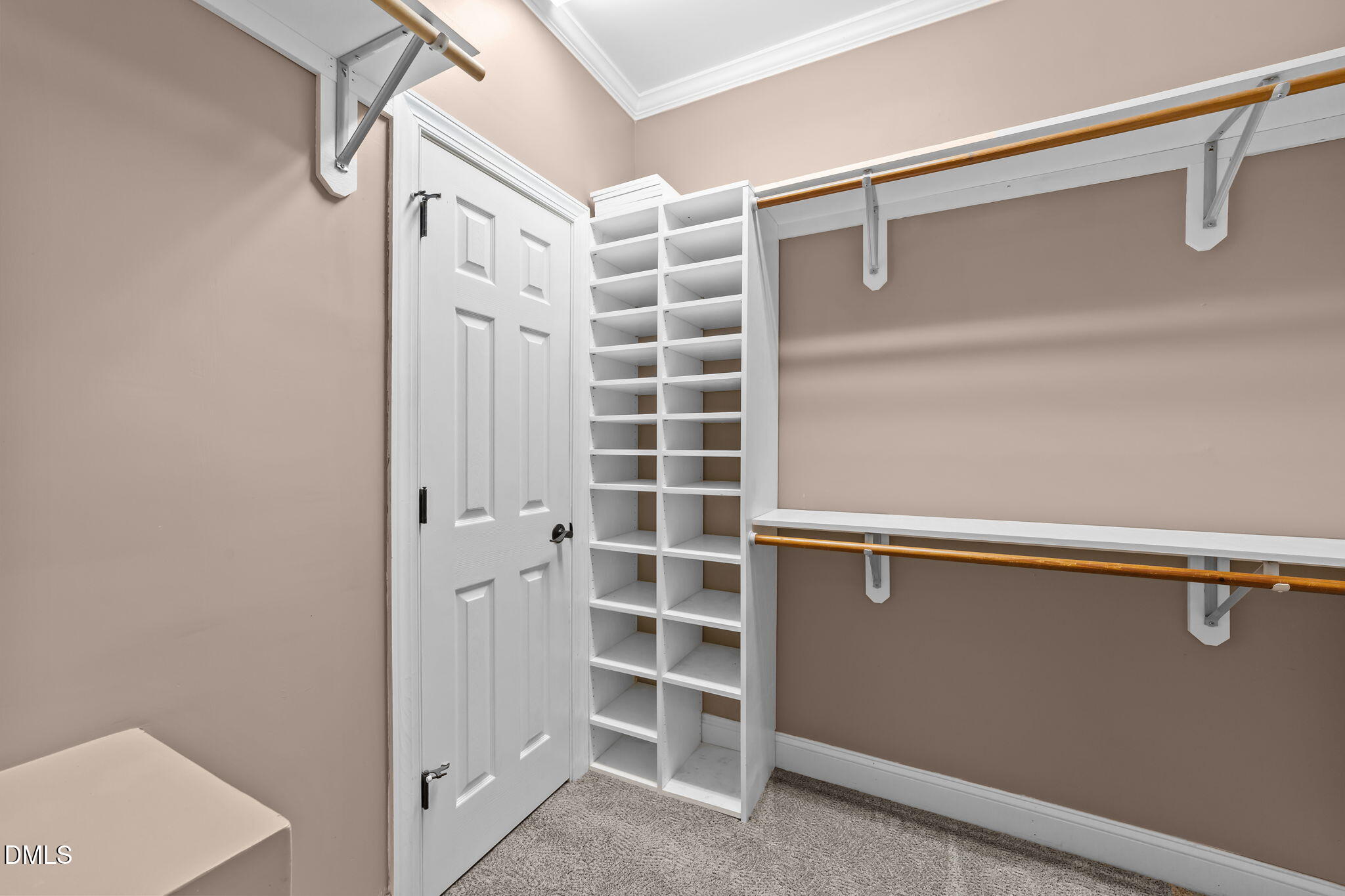 208 Adams Court Clayton, NC 27520 - Photo 28 of 63 a view of walk in closet with empty racks