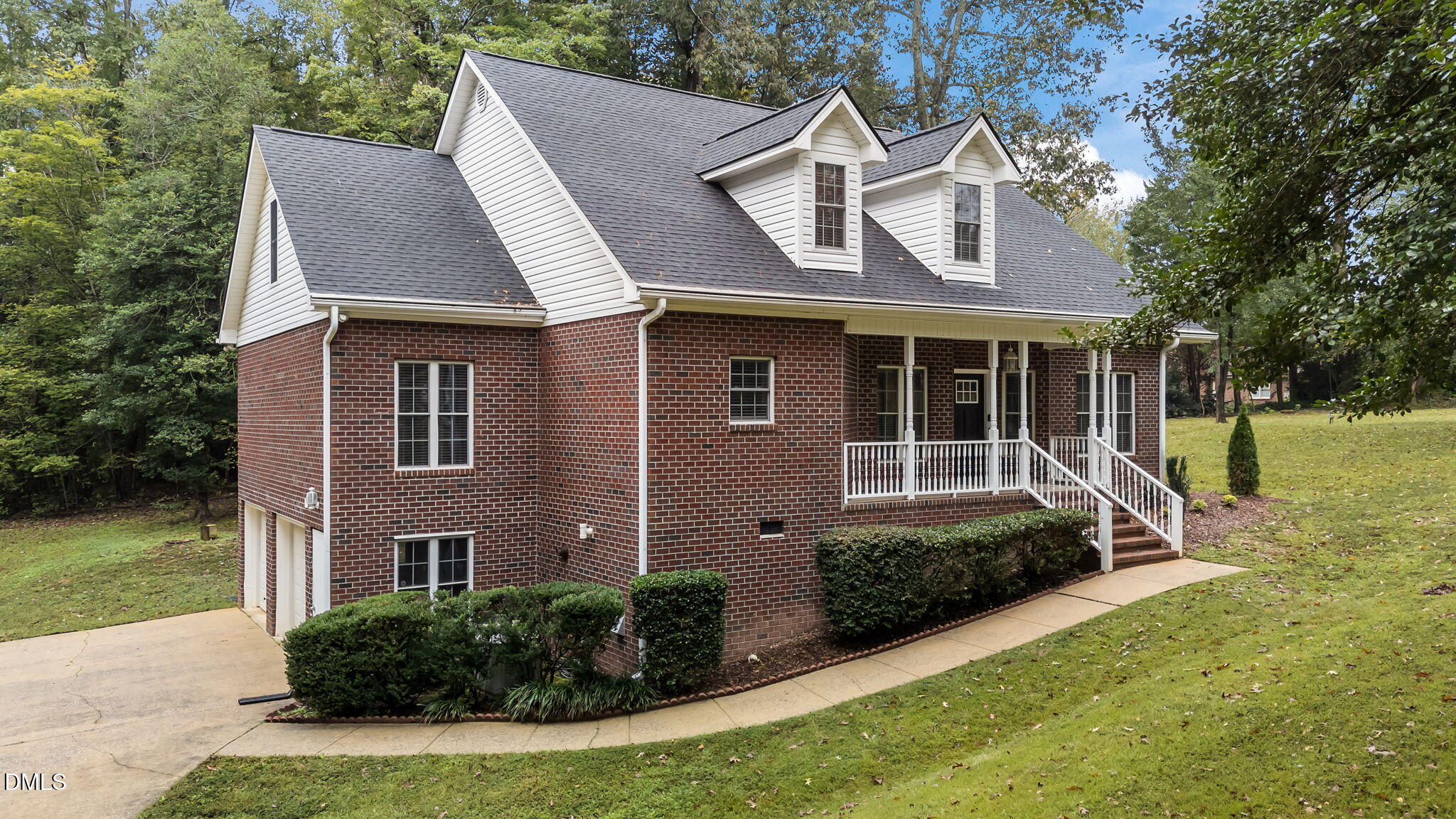 208 Adams Court Clayton, NC 27520 - Photo 3 of 63 a front view of a house with garden