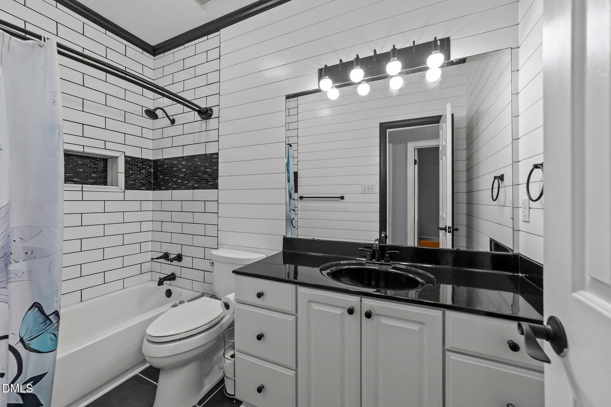 208 Adams Court Clayton, NC 27520 - Photo 32 of 63 a bathroom with a granite countertop toilet sink and mirror