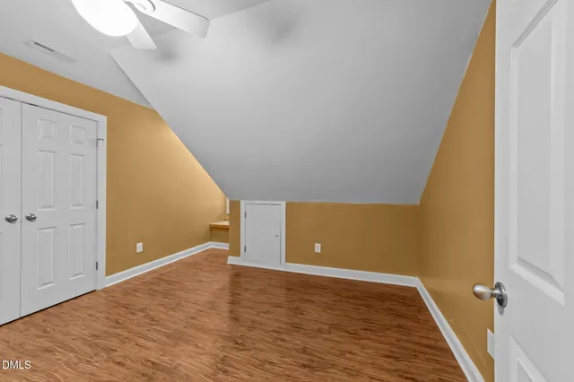 a view of a livingroom with wooden floor