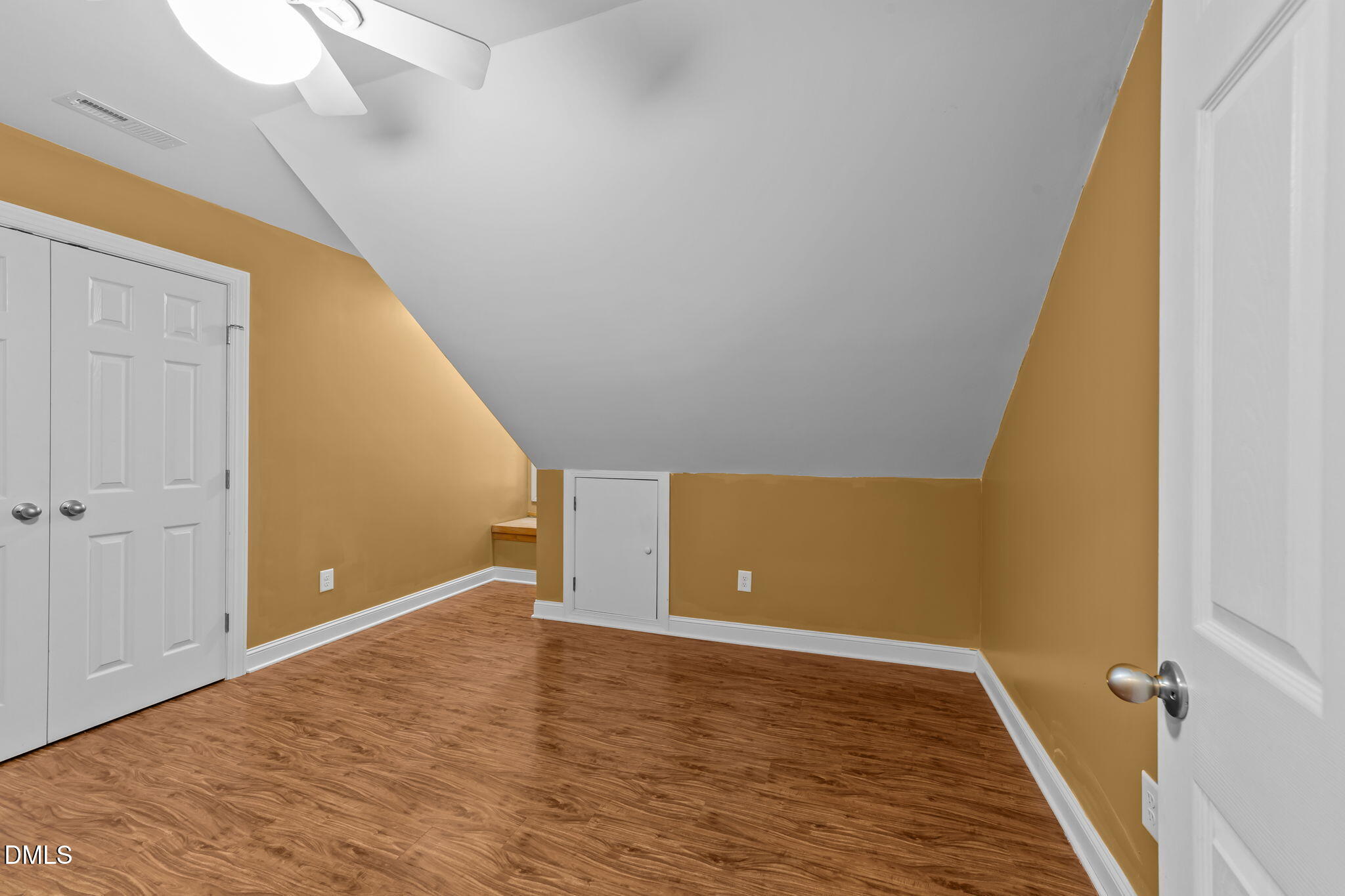 208 Adams Court Clayton, NC 27520 - Photo 35 of 63 a view of a big room with wooden floor and staircase