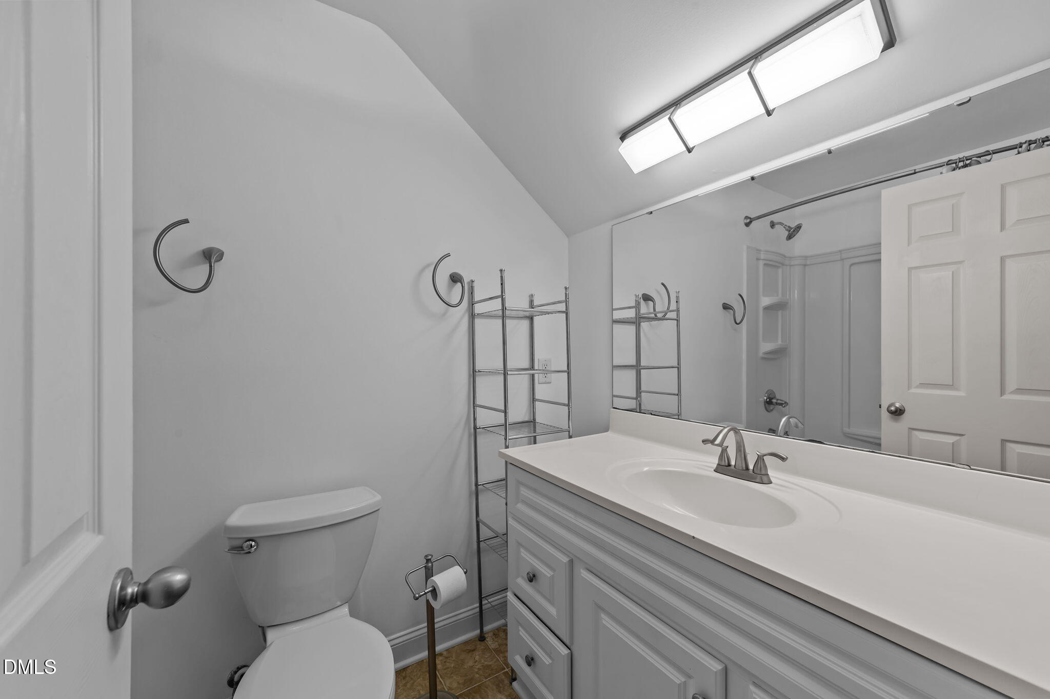 208 Adams Court Clayton, NC 27520 - Photo 37 of 63 a bathroom with a sink toilet and shower