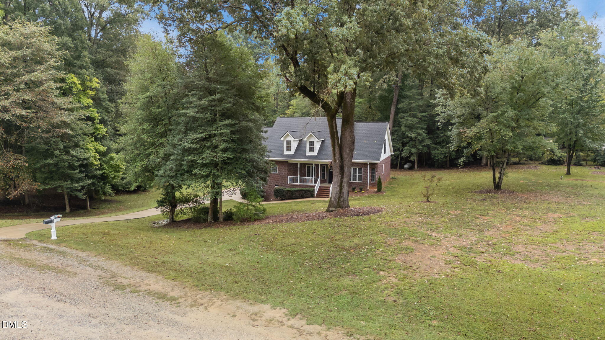 208 Adams Court Clayton, NC 27520 - Photo 52 of 63 a view of a tree in front of a house