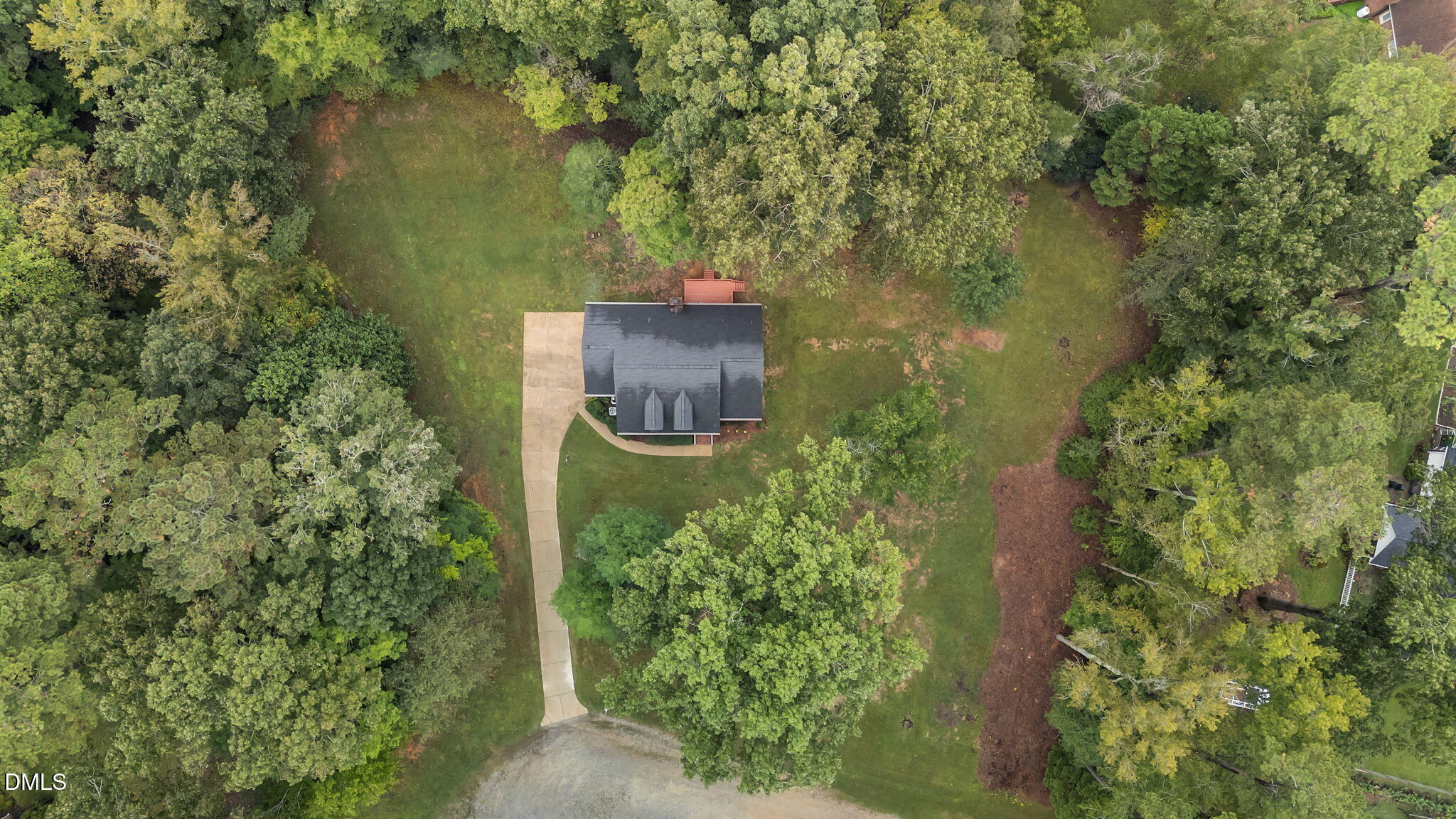 208 Adams Court Clayton, NC 27520 - Photo 57 of 63 an aerial view of a house with a yard